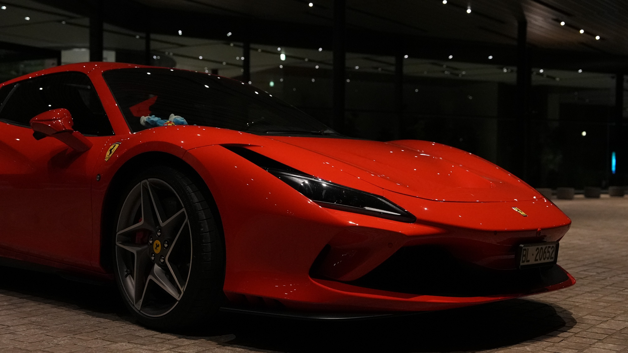 Ferrari F8 Tributo — low front angle at night