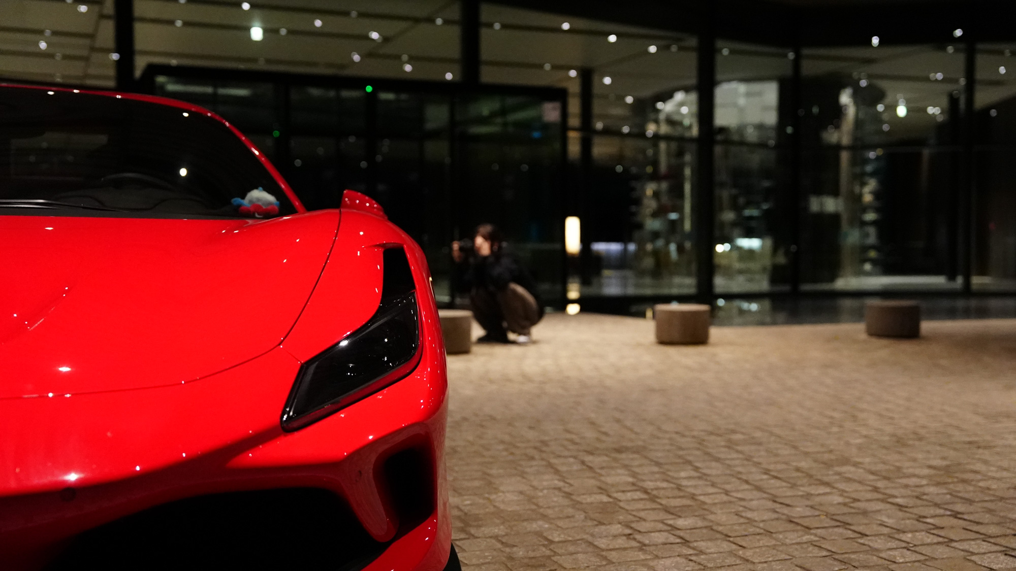 Ferrari F8 Tributo — rear corner, night atmosphere