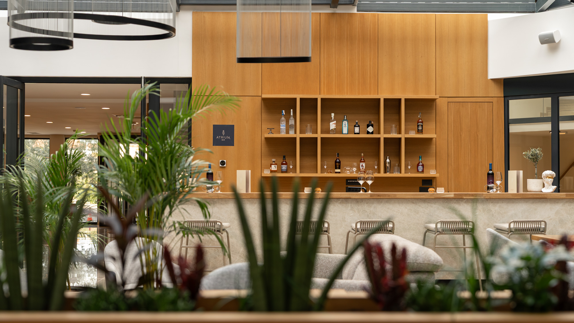 Bar viewed through plant foliage