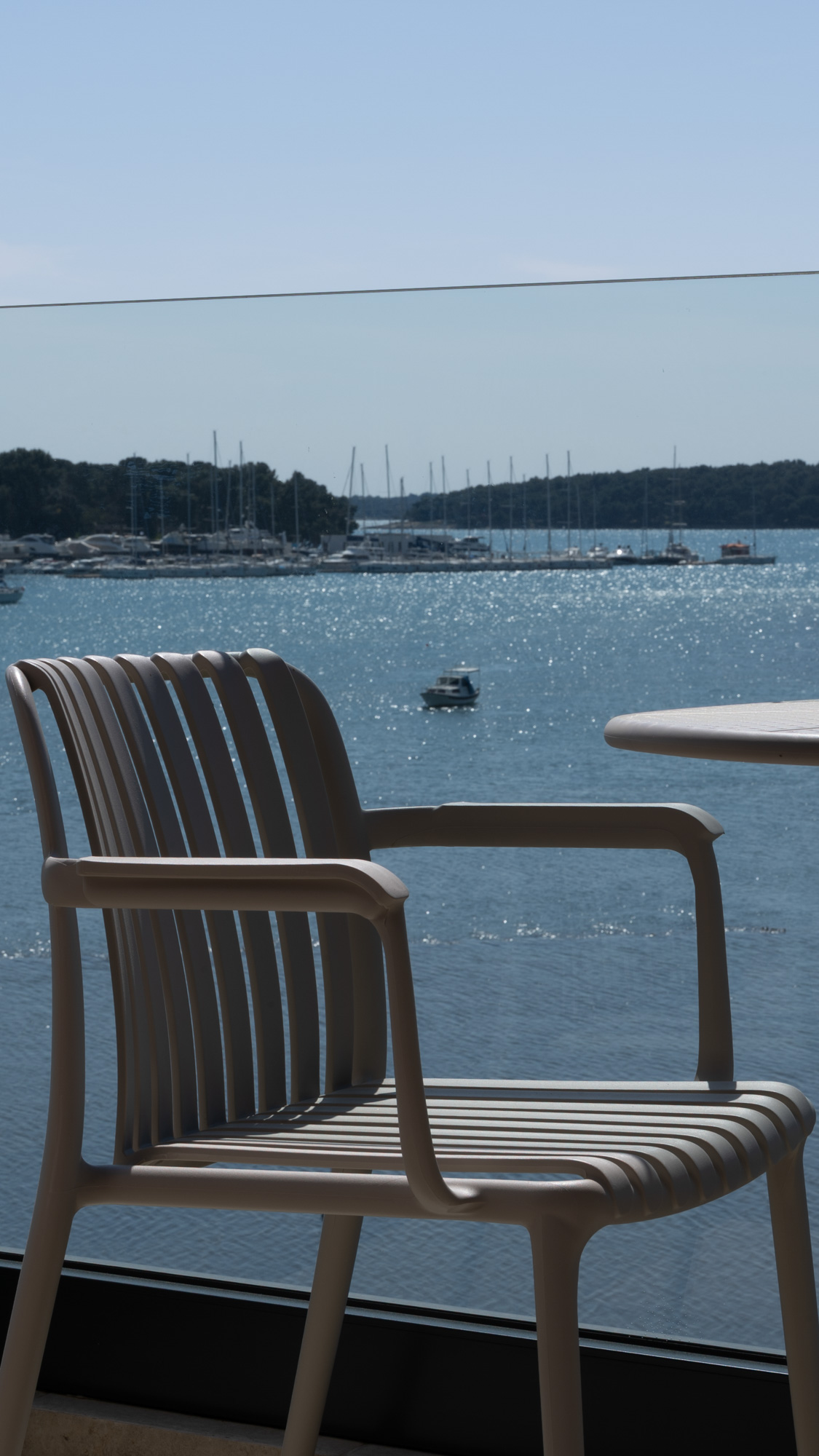 Terrace chair with marina view