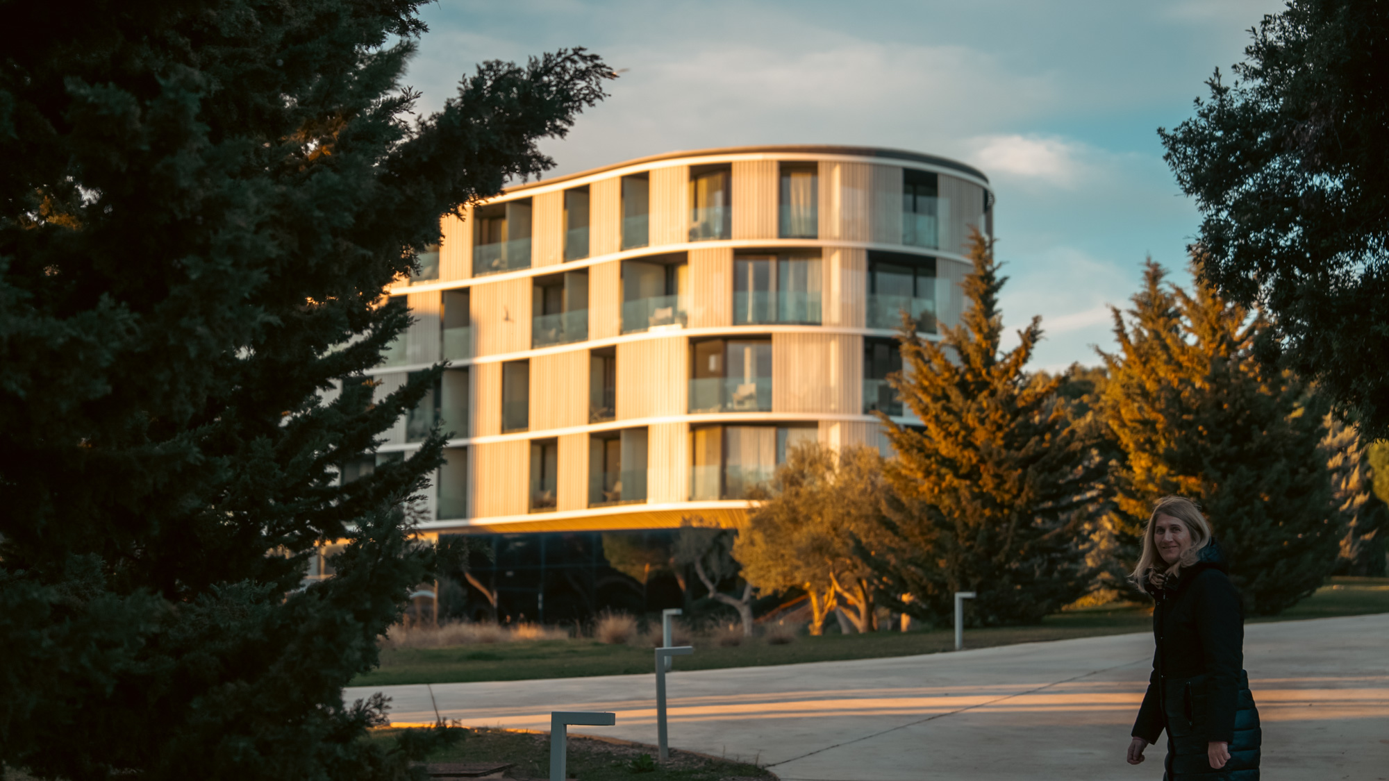 Amarin hotel facade in golden light with gulls overhead