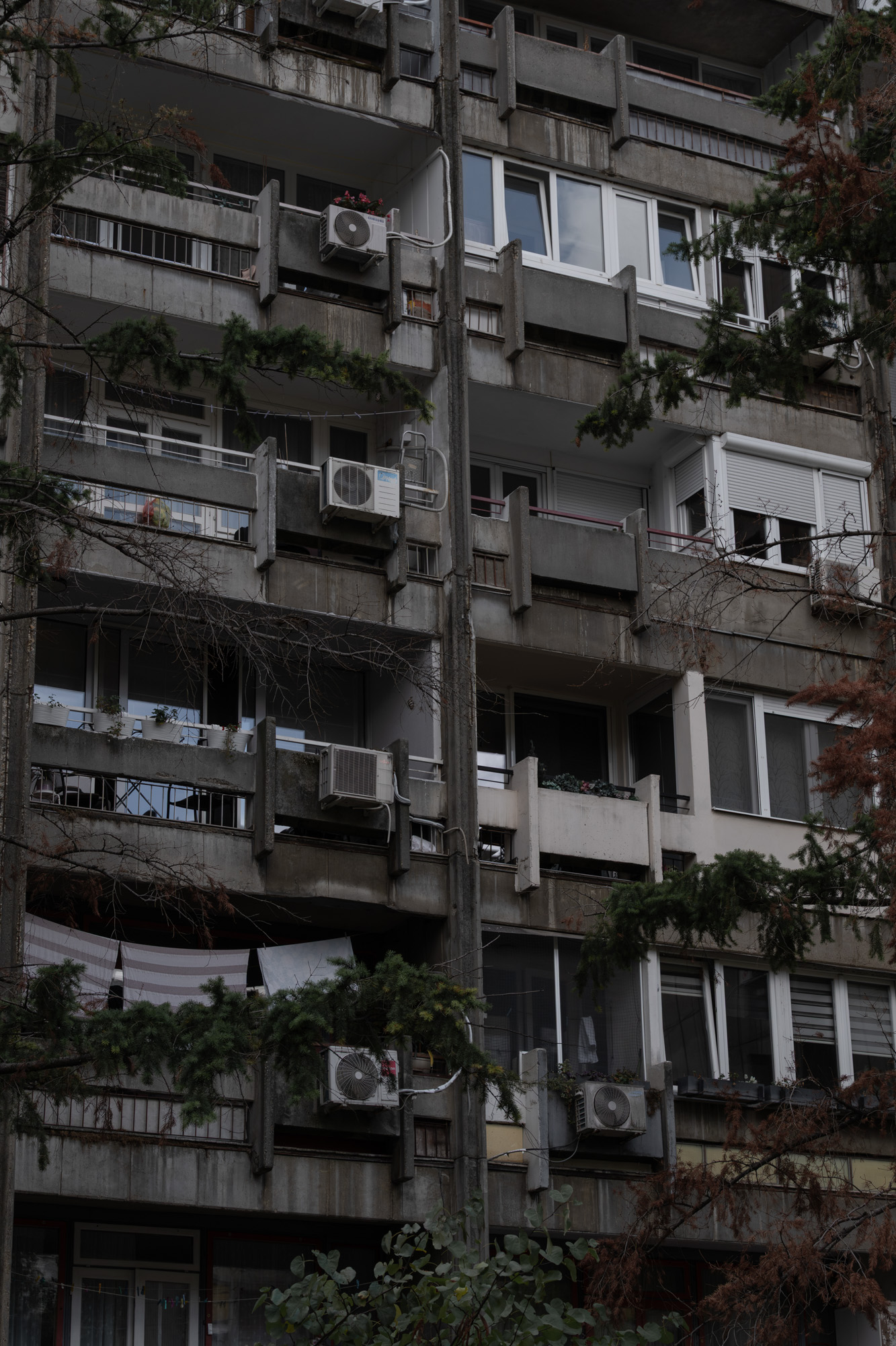 Brutalist apartment block with AC units, Belgrade