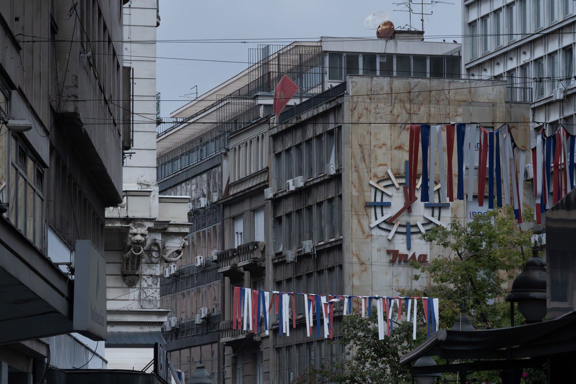 Socialist-era building with Serbian national flags, Belgrade