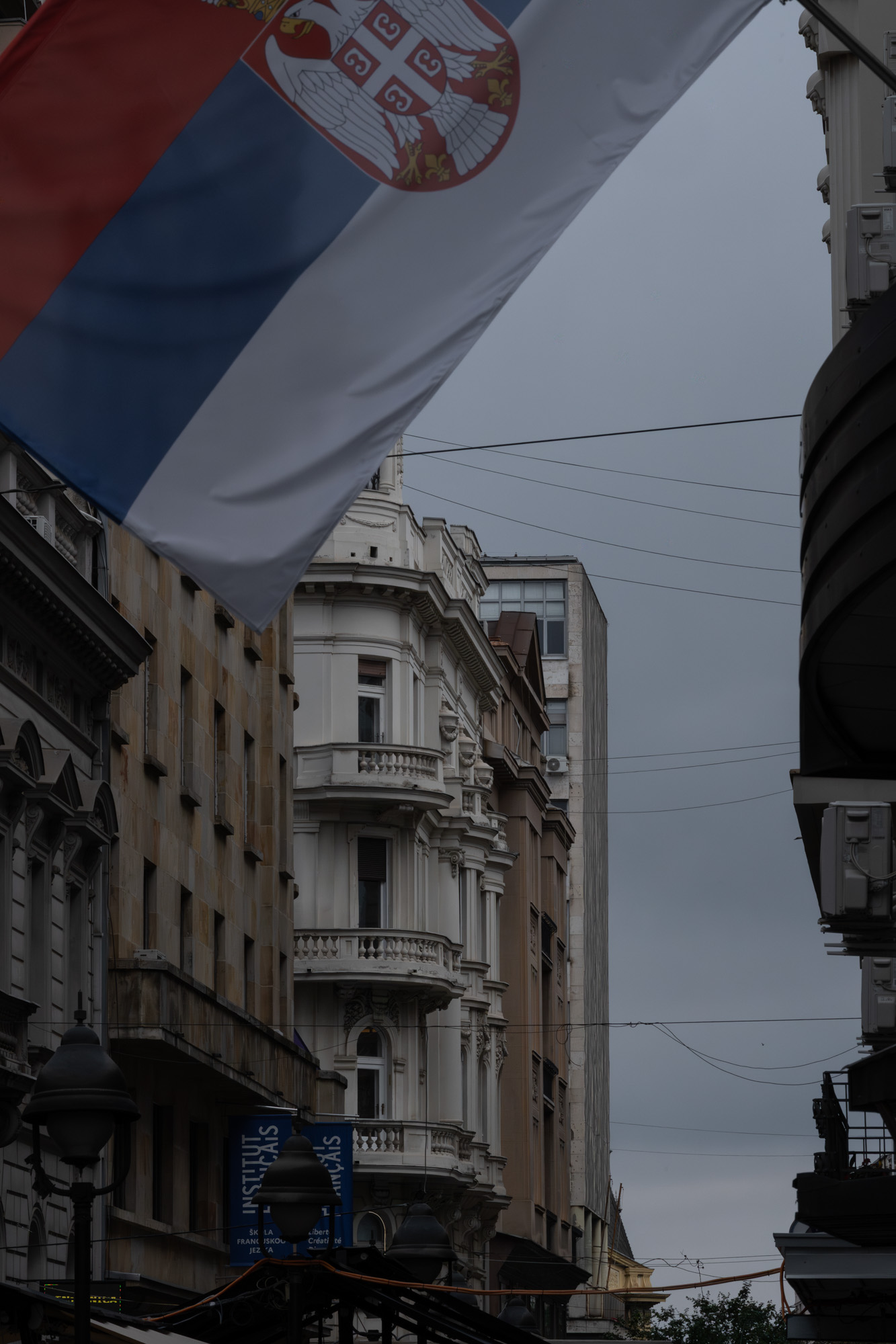 Serbian flag over a classical facade, Belgrade city centre