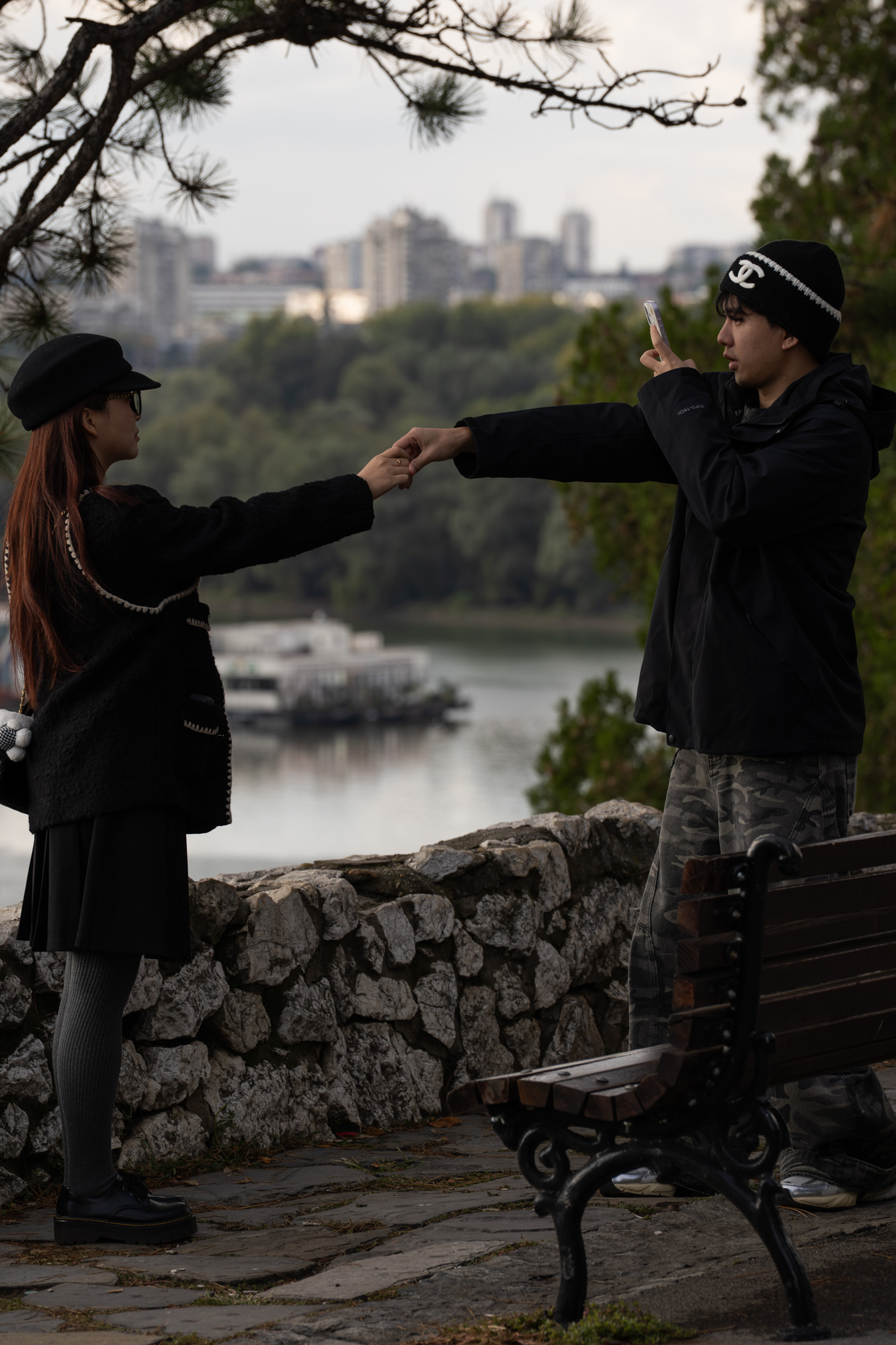 Couple at Kalemegdan fortress walls, river confluence in background